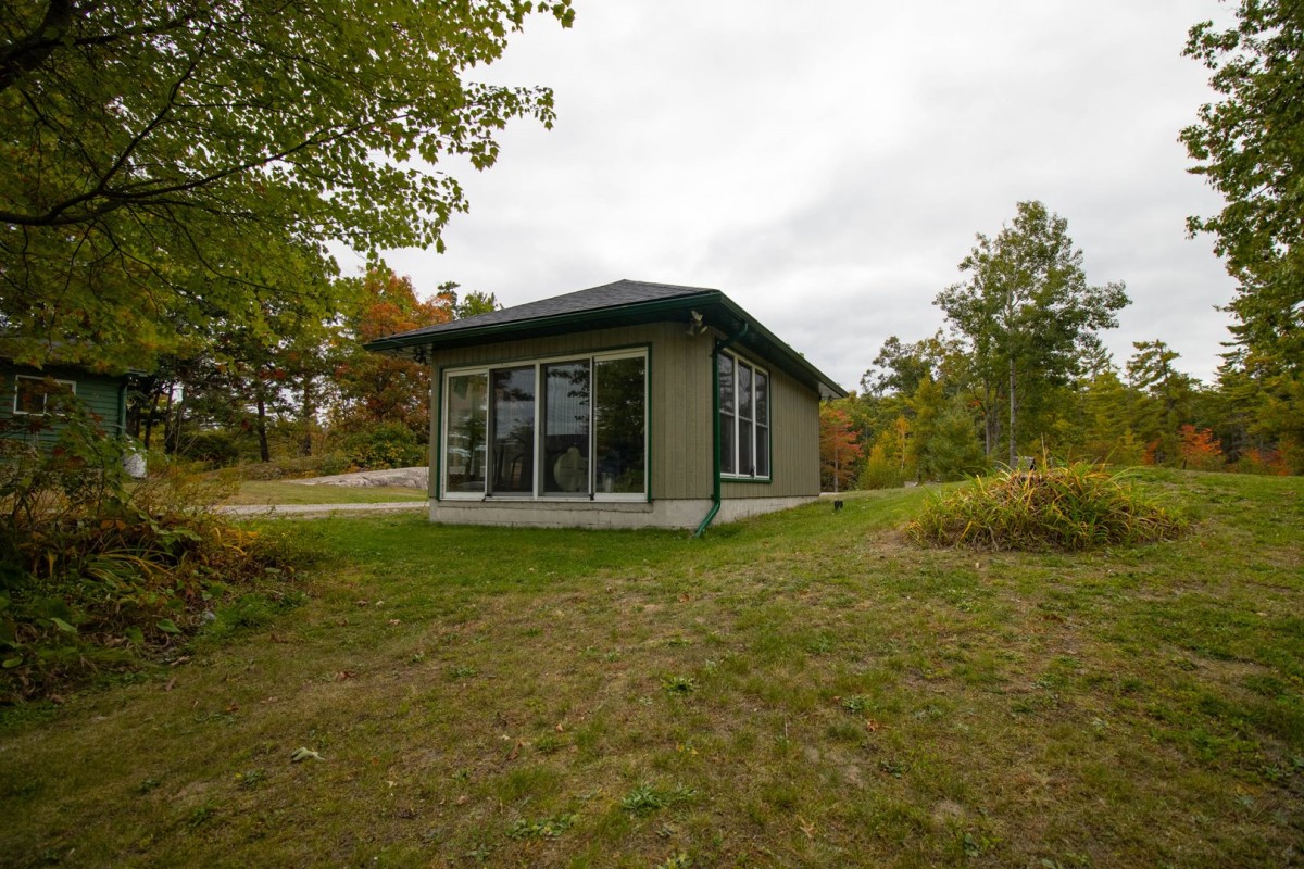 Gym with Floor to Ceiling Windows overlooking the lake