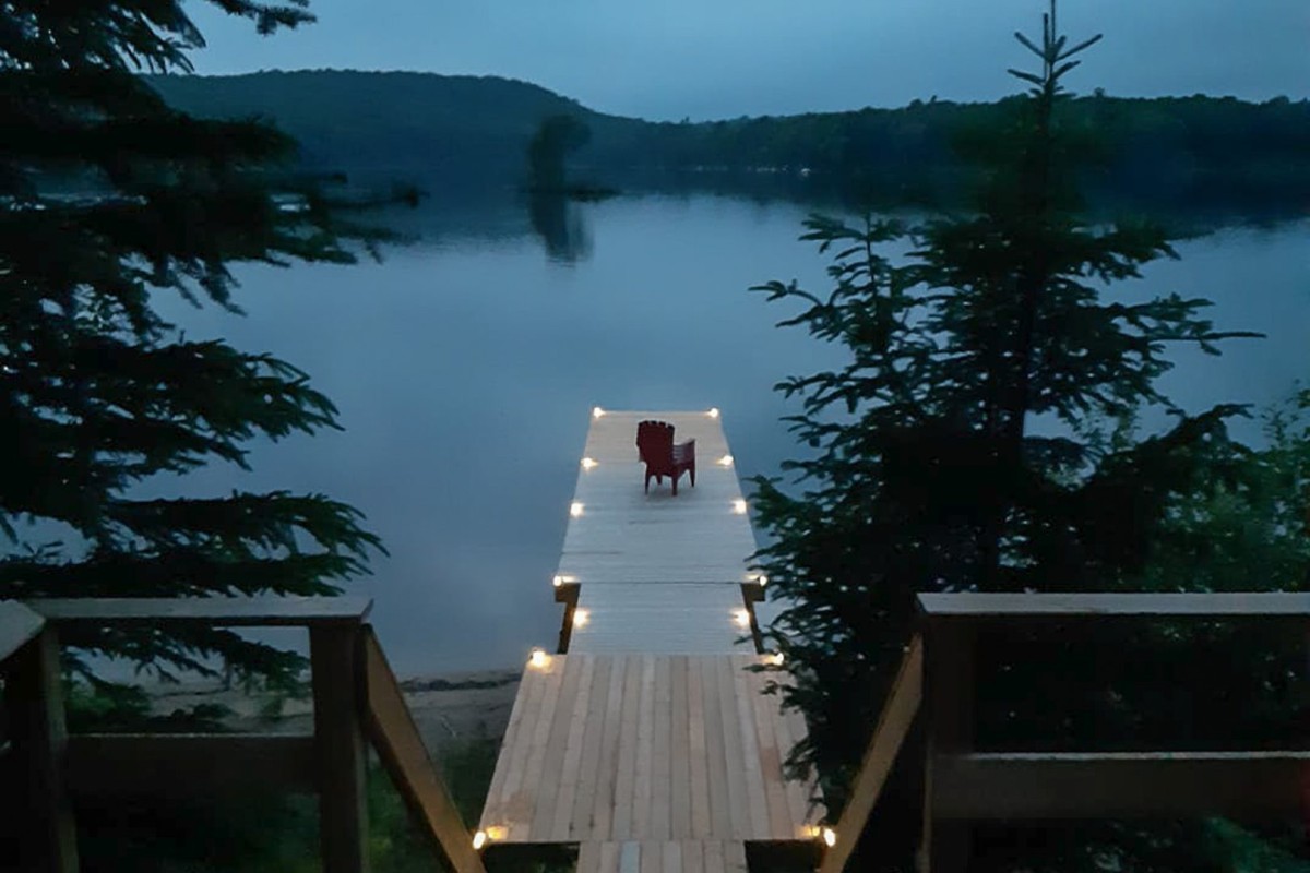 Dusk view of lake and dock