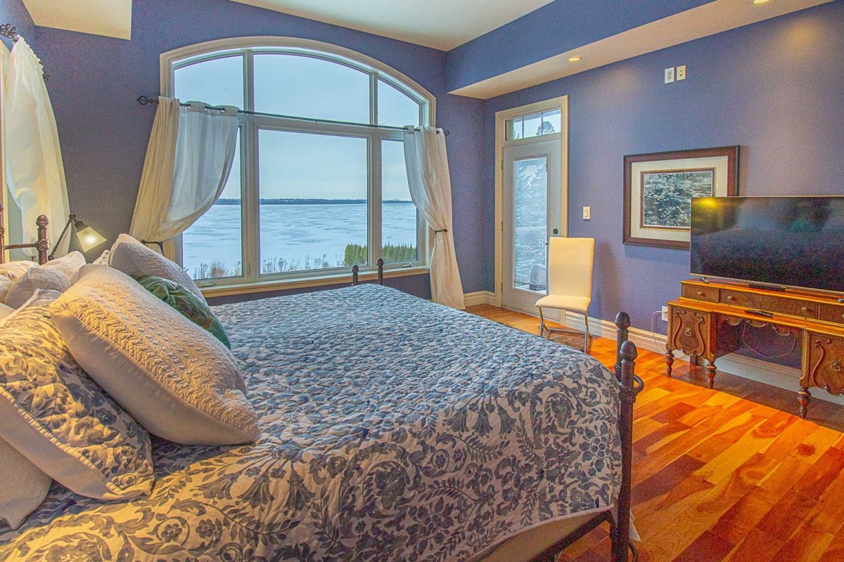 Primary Bedroom with stunning Sturgeon Lake Views