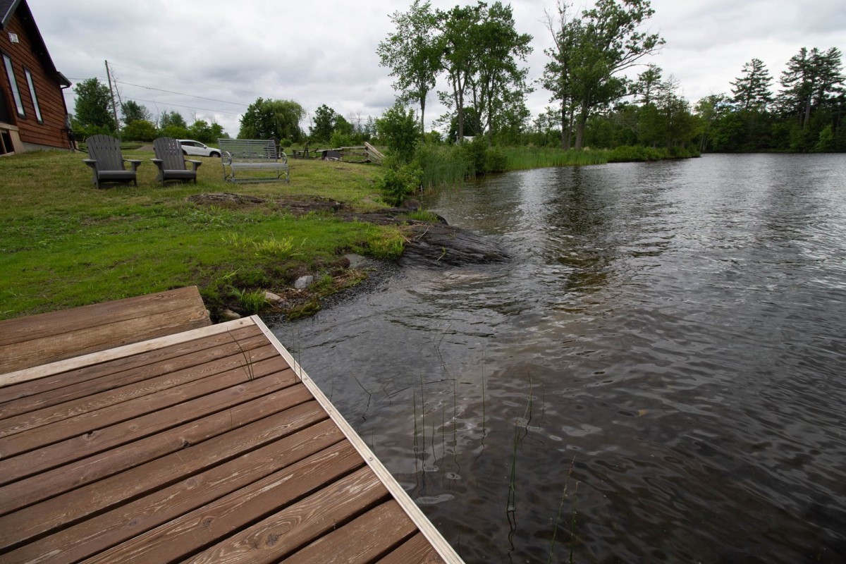To the left of the dock