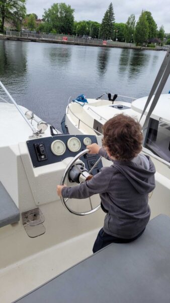 A child steering a boat