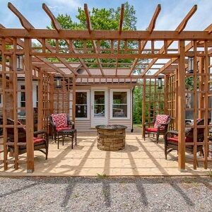 A house's patio with a wooden pergola