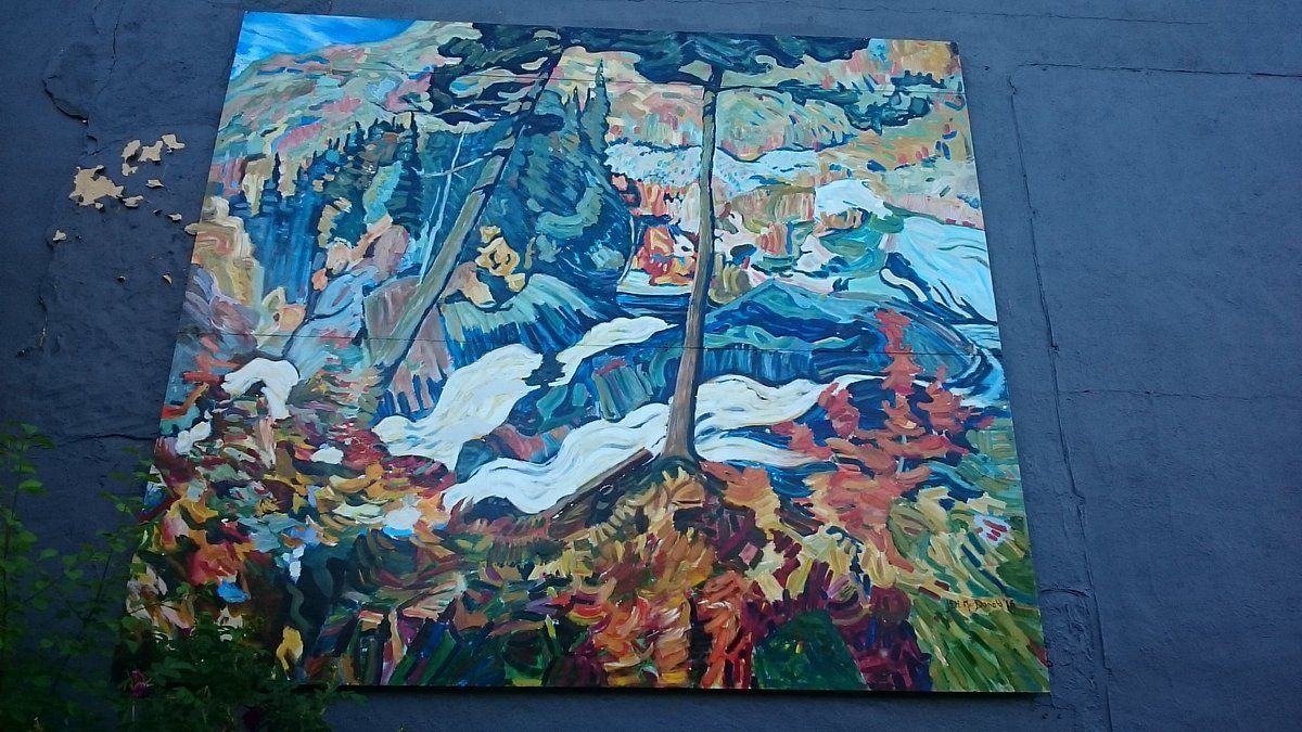 Group of 7 inspired mural painted on an exterior wall in Huntsville, Muskoka